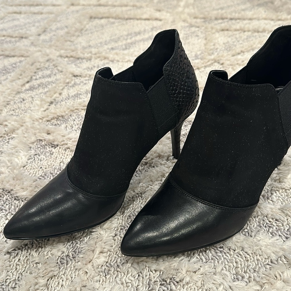 Ankle booties w some leather, suede and snake skin.
